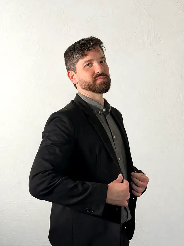 Retrato do Dr. Elson Mendes de blazer preto
